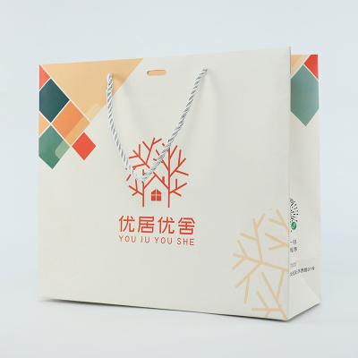 China Boutique Shopping Clothes Custom Logo Paper Bag Printed White With Ribbon Handle for sale