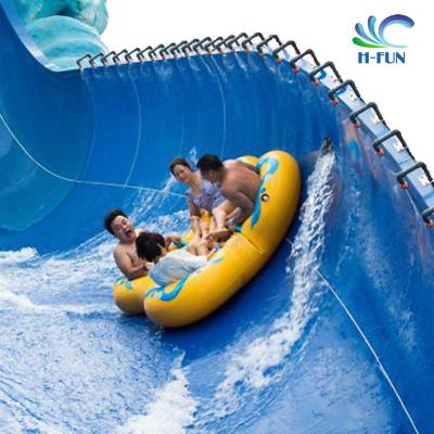 中国 New design inflatable waterpark slide tubes cloverleaf tubes with soft seat pad for water park equipment 販売のため