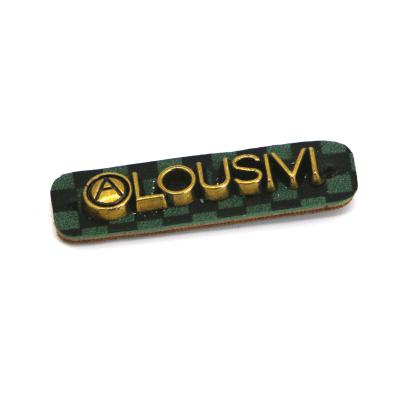 中国 衣服の銅の物質的なロゴ パターンOEM ODMのための緑の革パッチ 販売のため