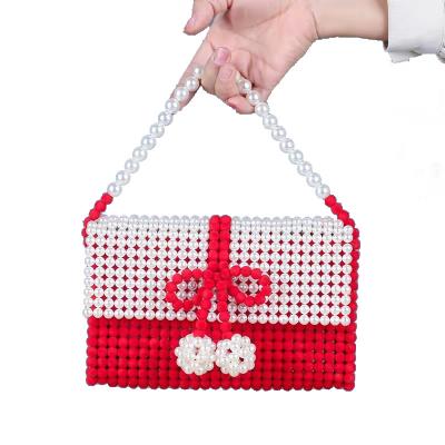 China Red Beaded Clutch Pearl Bag Flower Wrist  Hand Woven With White Cap OEM ODM for sale