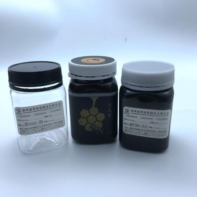 China O quadrado dá forma ao armazenamento preto Honey Plastic Jar da cor 400ml dos frascos claros do animal de estimação da cor à venda