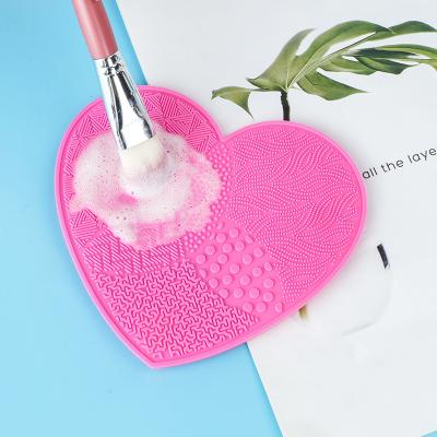 China Heart Shaped Silicone Makeup Mat Suction Cup Brush Cleaning Pad for sale