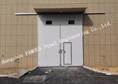 Китай Секционные горизонтальные сползая промышленные двери гаража с дверью доступа пешеходной для мастерской продается