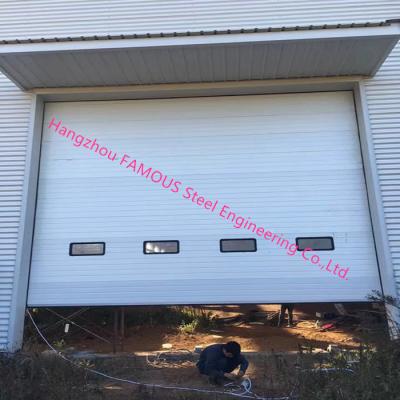China Full Vertical Lift Door Motorized Industrial Garage Doors With Transparent Windows And Pedestrian Access for sale