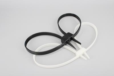 China 12*700mm white and black strong double loop Unbreakable soft plastic cable tie one time police handcuffs for sale