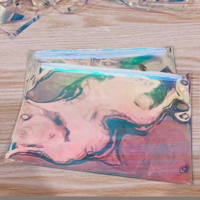 China Glitter Pvc Holographic Bag Clear Laser Cosmetic Makeup Private Clothing Brand Packaging for sale