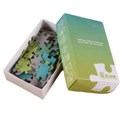 China La caja del rompecabezas del papel de Diy fijó los juguetes educativos que los juegos juntan las piezas de niños de la historieta del rompecabezas en venta