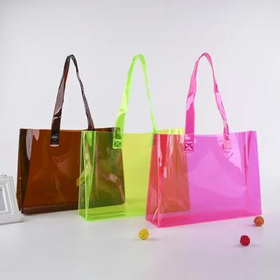 China Shiny Large Clear PVC Tote Bag Mini With Handle Clear Colorful Purse for sale