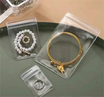 China Gift Clear PVC Packaging Bag For Business With Zipper Self Sealing Zip Lock Ring Earrings for sale