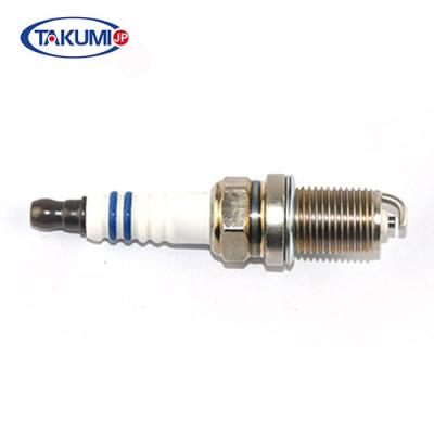China Industrial Two Wheeler Spark Plug 18.9mm Rotation Length Multi - Ribbed Insulator for sale