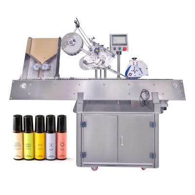 China YM215 Automatic ampoule horizontal label applicator for lip balm tube paste labeling machine for sale
