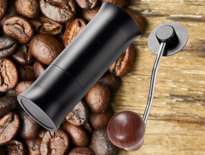 中国 クルミのハンドルが付いているより小さい携帯用紙やすりで磨く手のオフィスのコーヒー豆挽器 販売のため
