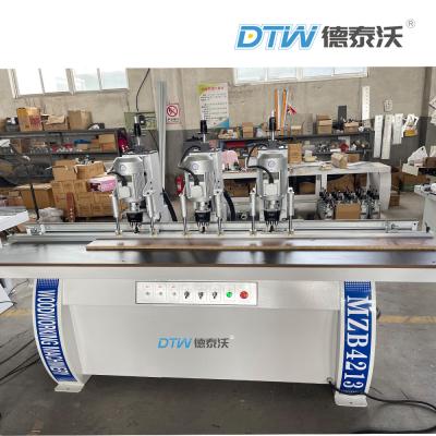 China DTW 3 Heads Wood Drilling Machine 35mm Hinge Boring Machine for sale