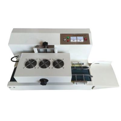 China Continuous Induction Sealing Machine For Medical Honey Bottle And Jars for sale