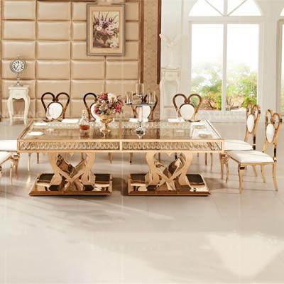 China Custom Golden Stainless Steel Glass Dining Table Luxury Rectangle Furniture for sale