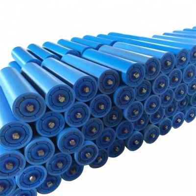 China Rodillos locos plásticos del entrenamiento del transportador del impacto del HDPE del tubo del polímero de 4 pulgadas en venta