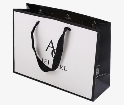 China customized design gift printed wholesale paper shopping bag with logo,custom paper gift shopping bag with handle for sale