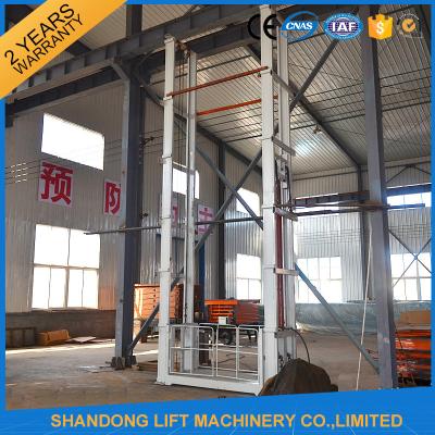 China 1.5 tons 5 m Hydraulic Outside Guide Rail Vertical Cargo Lift for Building Warehouse for sale