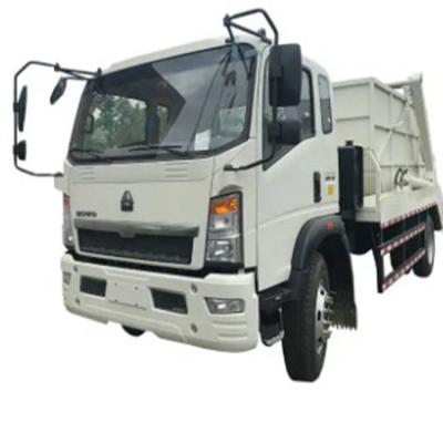 China SINOTRUCK HOWO 4x2 6x4 LHD 24m3 Hydraulische roll off vuilnisbak Truck Automatisch laden Weigeren Truck Compactor Te koop