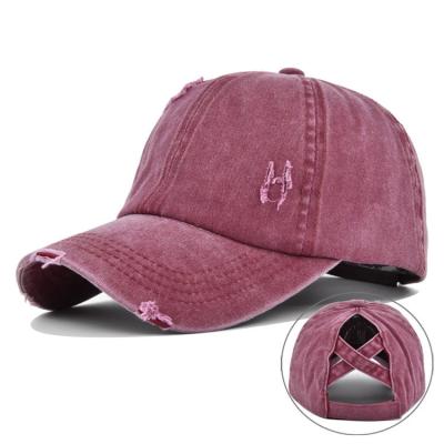 中国 女性の洗浄された苦しめられた綿のデニムの高いポニーテールの帽子の調節可能な野球帽 販売のため