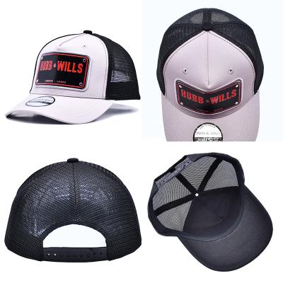 China Structured 5 Panel Trucker Cap Embroidered Debossed Metal Badge Eyelets for sale