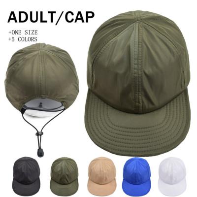 China 100% Cotton Drawstring Flat Brim Snapback Cap With Adjustable Strap for sale