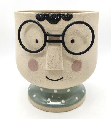 Chine Une fleur en forme d'enfant, un pot en 3D, en céramique. à vendre