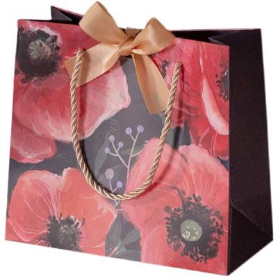 China COA Ladies Hand-Held Kraft Floral Shopping Bag Flower Paper Bag Handbag for sale