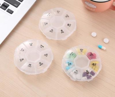 China Round Shape Pill Dispenser Organizer Clear Plastic Daily Weekly Pill Storage Box for sale