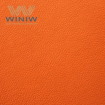 China Competitive Price Orange PVC Synthetic Leather Breathable  Durable luxurious property auto upholstery leather for sale