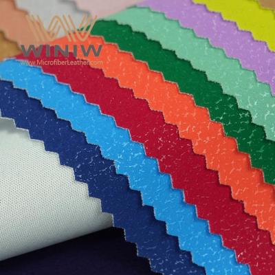 China Material texturizado cáscara de naranja de moda de la imitación de cuero del vendedor de la tela de la piel sintética por la yarda en venta
