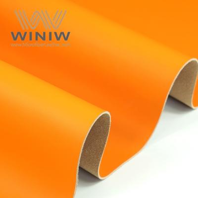 China Microfiber Fluorescent Orange Printed Faux Leather Sheets For Couch Decoration for sale