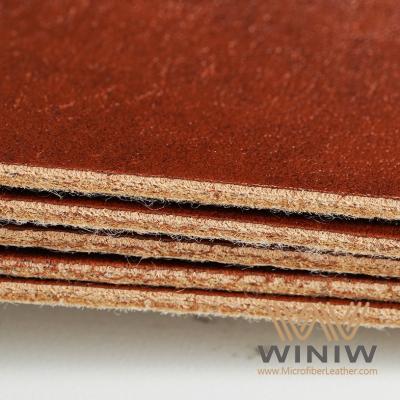 China Material de cuero falso de tejido de poliuretano Cuero para etiquetas en venta