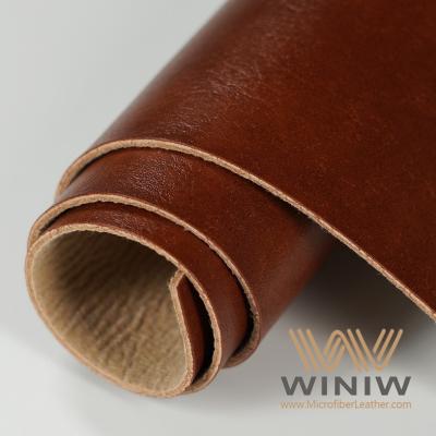 China Material de tecido de couro poliuretano PU de qualidade superior para fabricação de rótulos à venda