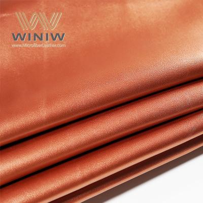 China 1.4mm Orange Micro Fiber PU Vegan Leather Bags Making Leather Fabric Material for sale