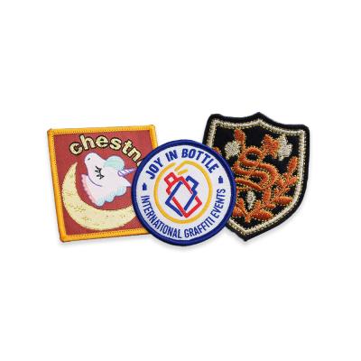 China Multiple Logo Acceptable Iron On Embroidered Patches Badges Twill Fabric Custom Size for sale