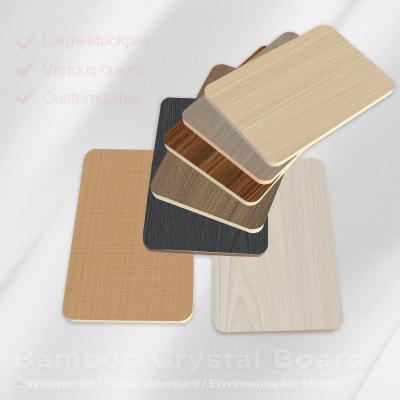 中国 8mm PVC Wall Panel Decorative Fireproof Wood Veneer Bamboo Fiber Seamless Wall Board 販売のため