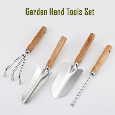 China Kit de herramientas de jardín de acero inoxidable de 4 piezas con mango de madera en venta
