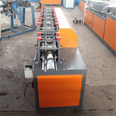 China Galvanized Steel Guiding Column Shutter Door Roll Forming Machine for sale