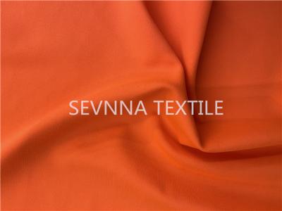 China UV Protection Recycled Swimwear Fabric Spandex 4 Way Stretch Free Cut Orange for sale
