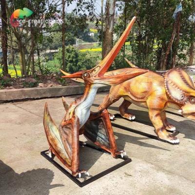 China 220vac 3D Fiberglass Realistic Looking Dinosaurs Struggled Pterosauria Statue Outdoor for sale