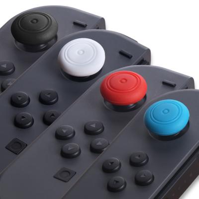 Chine Les chapeaux ronds assortis simples de thumbstick de silicone de couleurs pour la joie de commutateur de Nintendo escroquent la poignée de pouce de contrôleur à vendre