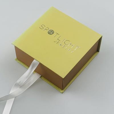 China Simple Paper Gift Packaging Box Silver Stamping Ribbon Closure Square Souvenir Gift Box for sale