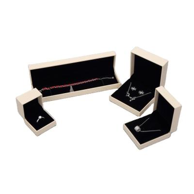 China Beige Special Paper Luxury Plastic Jewelry Box Balck Plush Inner Ring Jewelry Gift Box A Series Of Jewelry Packaging Set for sale