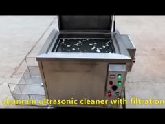 Ultrasonic cleaner with filter