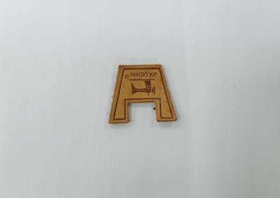 China Sew On Clothing Genuine Leather Patches Embossed Logo For Garment for sale