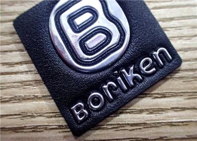 China Black Embossed Leather Patches With Silver Embossment TPU Logo For Bags for sale