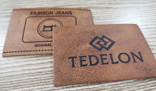 Embossed Logo PU Leather Patches Custom Color Sew On Clothing