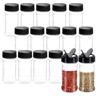 China Bulk 3.5 Oz Plastic Spice Jars Plastic Seasoning Bottles With Black Screw Lids for sale