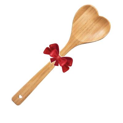 China Cuchara de bambú en forma de corazón de madera grabada para cocinar la cucharada de amor en venta